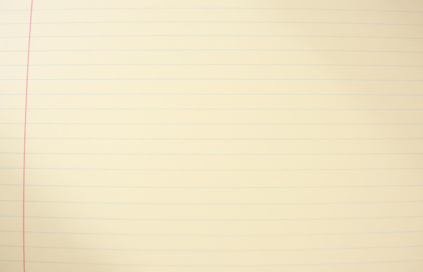 Close-up of aged cream ledger paper with faint ruled grid lines